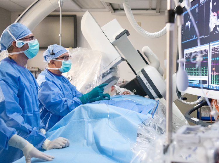 Electrophysiologists perform a procedure on a patient in the EP Lab
